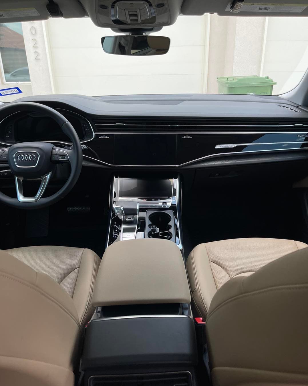 Detailed Audi Q7 dashboard and center console, wiped and dressed to a clean matte finish